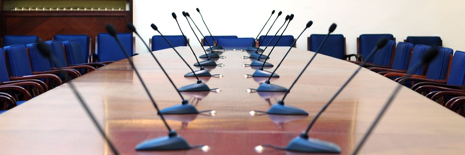 bigstock-Microphones-In-Empty-Conferenc-1098299