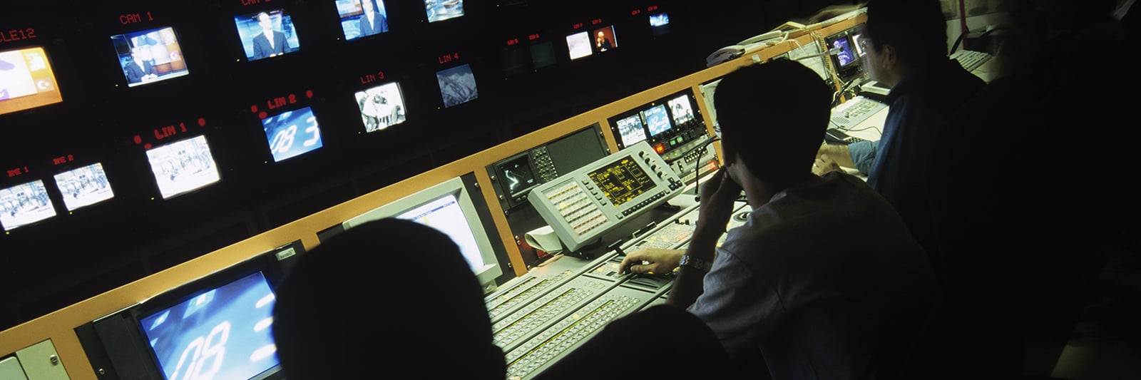 bigstock-Rear-view-of-operators-in-cent-48653480_1600x533